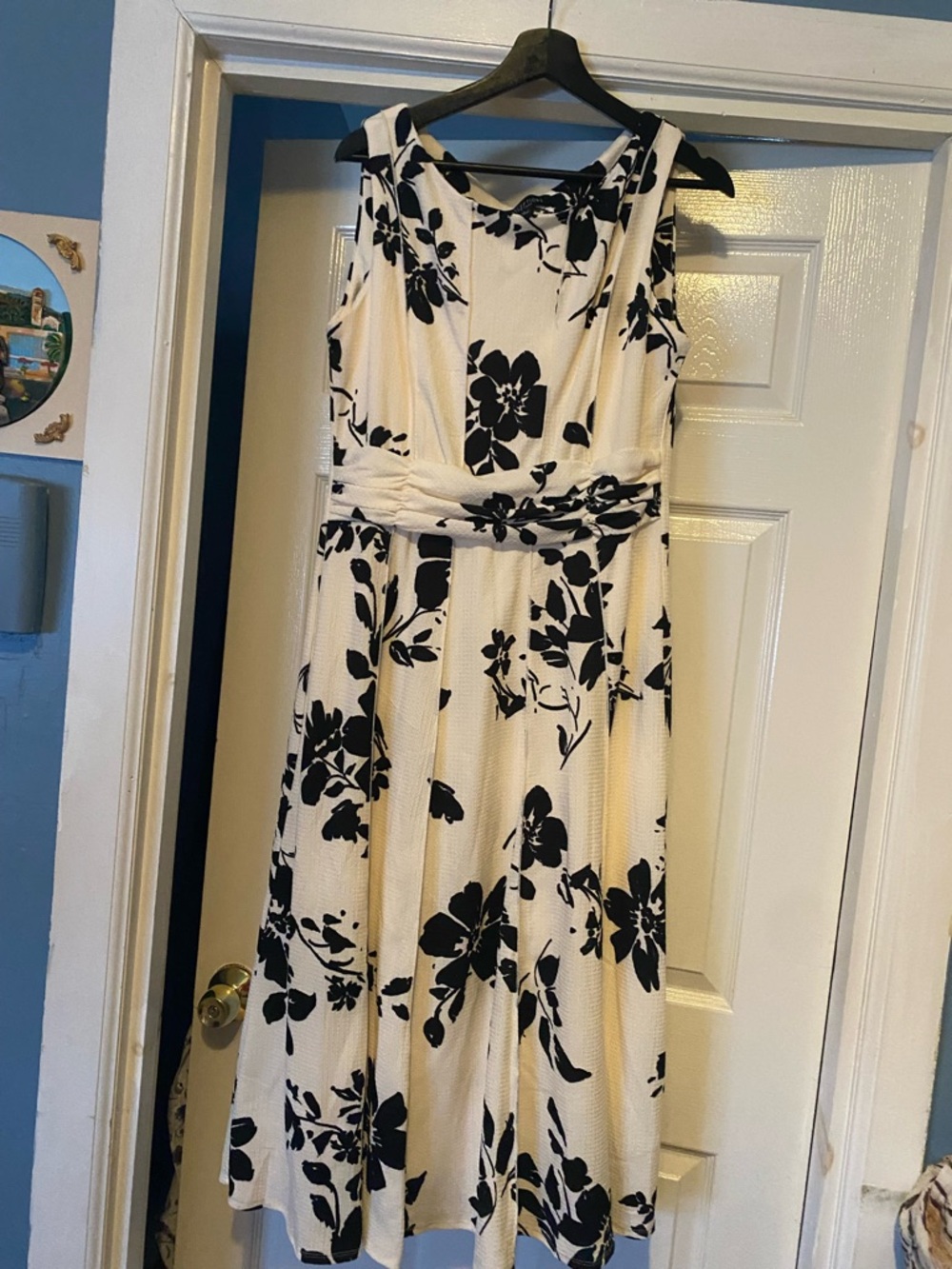 Sleeveless Cream Midi Dress with Black Floral Print and Twisted Waist Perception
